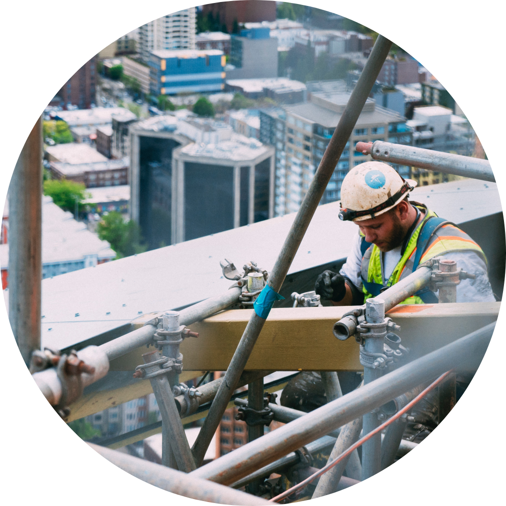 Image of construction worker on high rise scaffolding